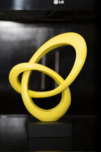 a yellow object sitting on top of a table at The Oasis I, Portmore Country Club in Portmore