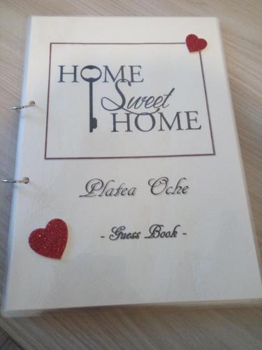 a greetings card with two hearts and a home sweet home sign at Platea Oche in Sutri
