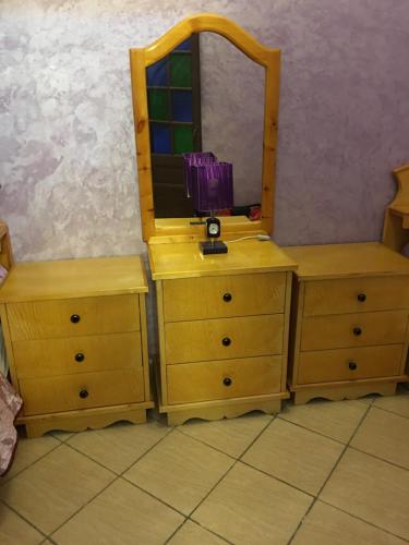 a dressing room with a mirror and two dressers at Médina Flat in Rabat