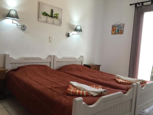 Postel nebo postele na pokoji v ubytování Alexander Apartments