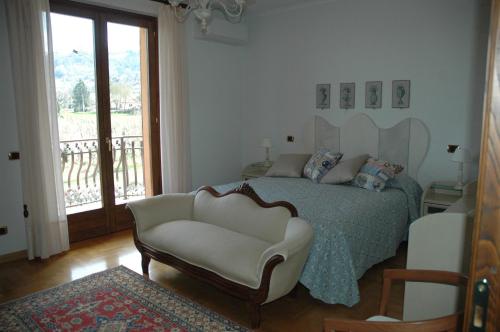 Tempat tidur dalam kamar di Casa Angolo delle Rose
