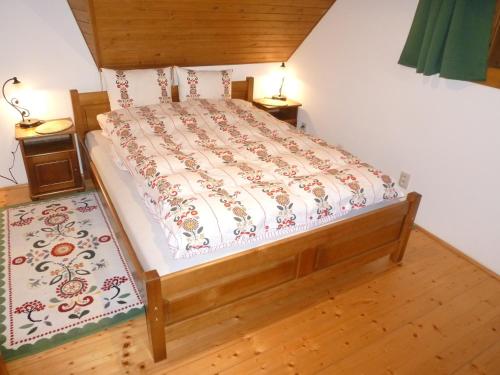 A bed or beds in a room at Drevenica u Maťa, Terchová