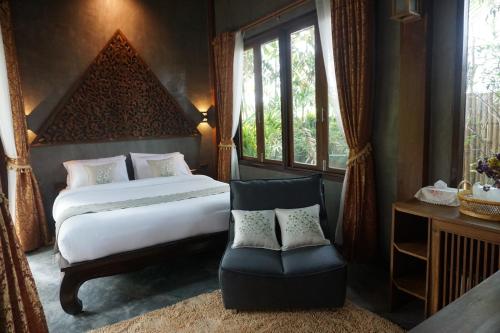 Postel nebo postele na pokoji v ubytování Baansuwanburi - บ้านสุวรรณบุรี