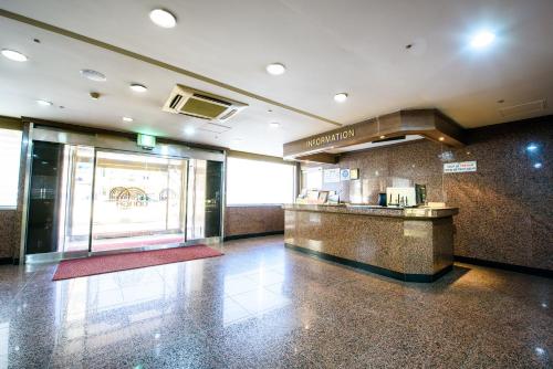 a lobby of a restaurant with a counter in a building at Gangneung Donga Hotel in Gangneung