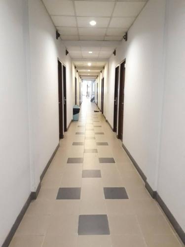 an empty hallway of an office building with white walls at New Siam II in Bangkok