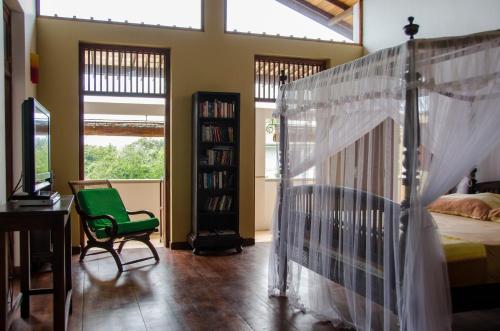 Postel nebo postele na pokoji v ubytování Villa Tara