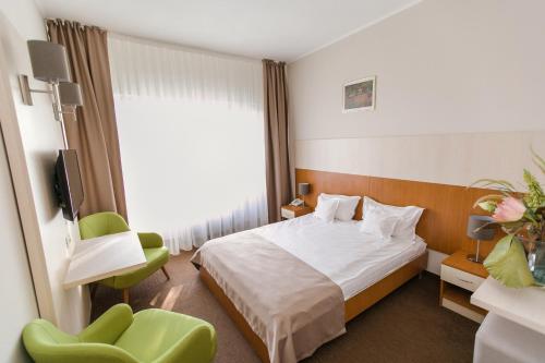Postel nebo postele na pokoji v ubytování Hotel Nufarul