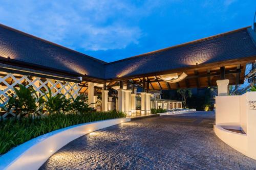 an exterior view of a building at night at Chaweng Regent Beach Resort in Chaweng