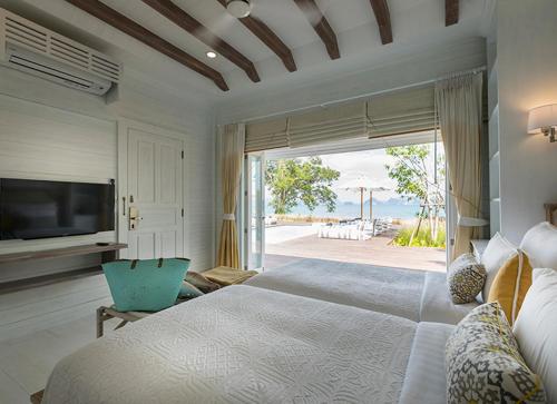 Postel nebo postele na pokoji v ubytování Cape Kudu Hotel, Koh Yao Noi