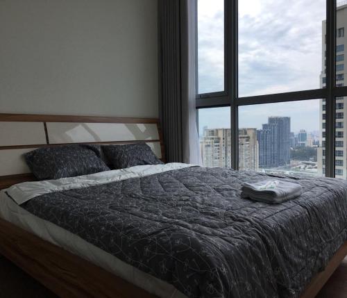 Ένα ή περισσότερα κρεβάτια σε δωμάτιο στο Vinhomes Central Park 2 Capitalland