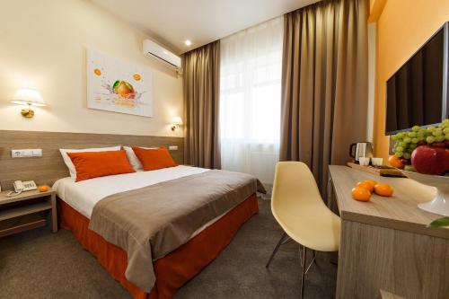 
Кровать или кровати в номере Отель Мандарин
