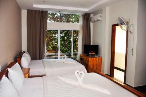 Postel nebo postele na pokoji v ubytování Sok Heng Guesthouse