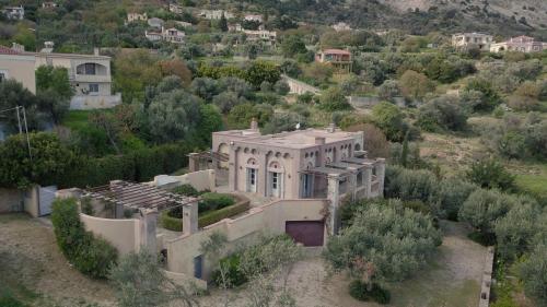 an aerial view of a house in a field at Vrontados Villa in Vrontados