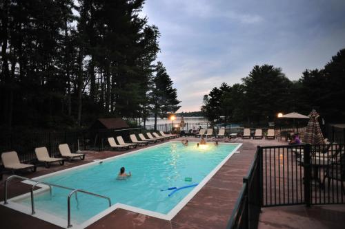 a person in a swimming pool at a resort at Sunset Bay Resort in Wisconsin Dells