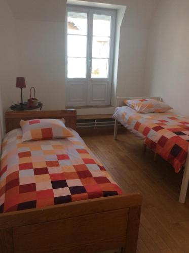 Ένα ή περισσότερα κρεβάτια σε δωμάτιο στο L’annexe