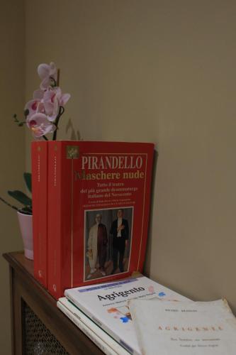 two books sitting on top of a table at L'Alba sui Templi in Agrigento