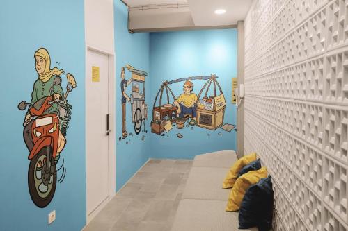 a childs room with a mural on the wall at Konko Hostel Jakarta in Jakarta