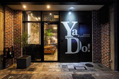 a store front with a sign on the door at Ya Do! KYOTO OKAZAKI in Kyoto