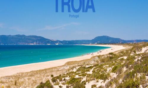 a group of people walking on a beach at Sea and Marina view Apartment in Setúbal
