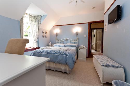 Postel nebo postele na pokoji v ubytování Edencoille Guest House