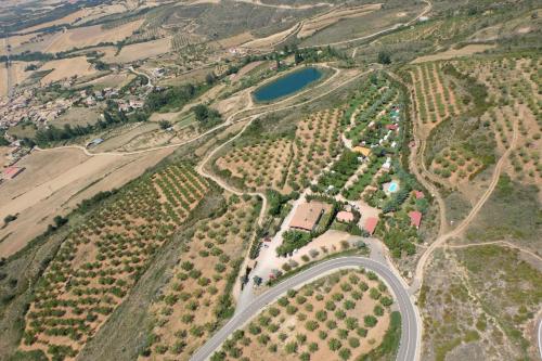an aerial view of a farm with a road at Camping Castillo de Loarre in Loarre