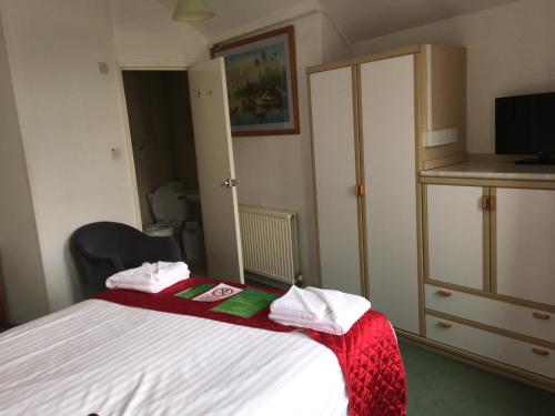 Un ou plusieurs lits dans un hébergement de l'établissement Ash Hotel B&B
