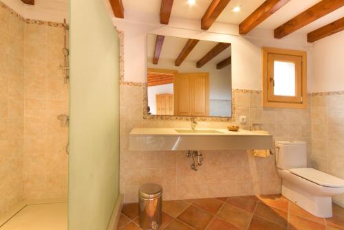 a bathroom with a sink and a toilet at Villa Truc in Pollença