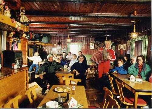 an old photo of a group of people in a restaurant at Hochalmblick in Mallnitz