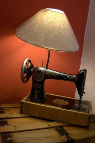 an old telephone with a lamp on a table at Hotel Boutique Posada XVII in Puebla