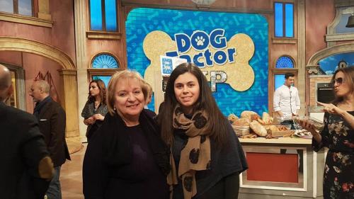 two women are standing in front of a dog depot at Agriturismo Casa Mattei in Arrone