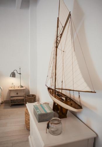a model of a sail boat on a table at Fonduco in Mahón
