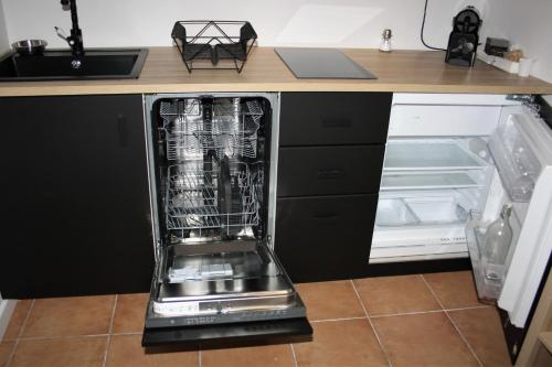 an appliance in a kitchen with its door open at Cassis et ses merveilleuses Calanques in Cassis