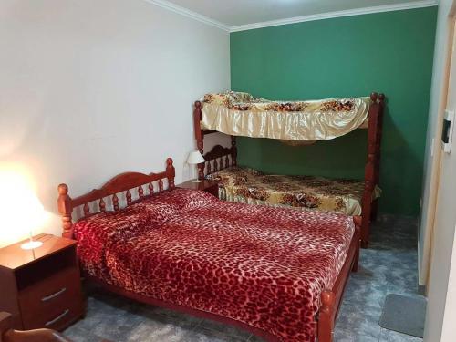 Una cama o camas en una habitación de Apart Hotel DEL LIBERTADOR