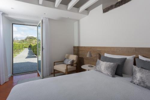 Säng eller sängar i ett rum på Quinta de Santa Clara