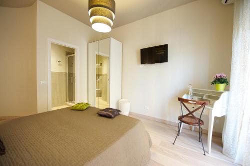 Un pat sau paturi într-o cameră la Quartopiano Guesthouse