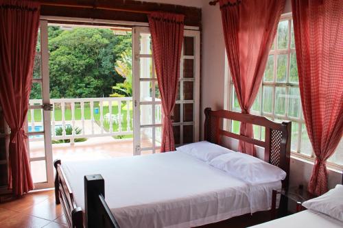 Una cama o camas en una habitación de Hotel finca Carmentea