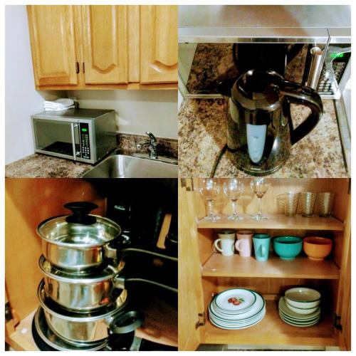 a kitchen with a coffee maker and a microwave at Rothesay Motel in Rothesay