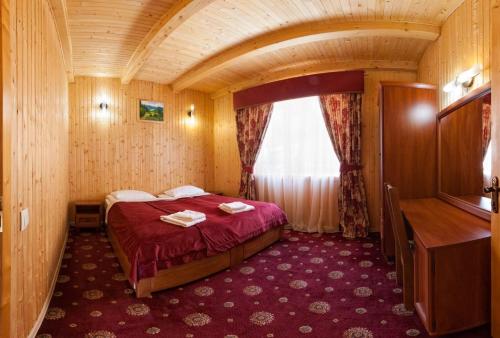 Кровать или кровати в номере Solnce Karpat