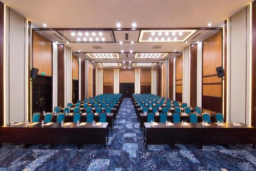 a conference room with blue chairs in the middle at Seahorse Resort & Spa in Mui Ne