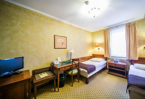 Postel nebo postele na pokoji v ubytování Hotel Opera