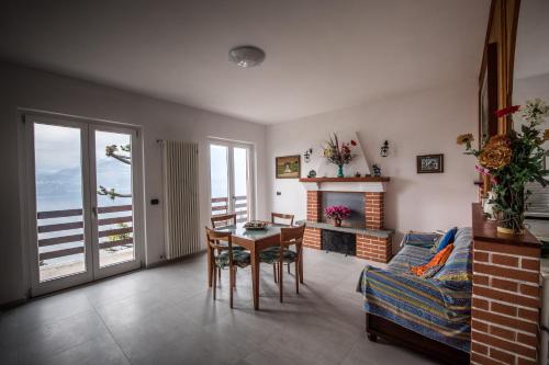 a living room with a table and a couch at Villa Bianca in Varenna