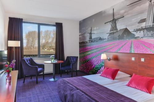 Кровать или кровати в номере Fletcher Hotel-Restaurant Zevenbergen-Moerdijk