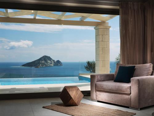 a living room with a view of the ocean at Avra Luxury Villa & Spa in Keri