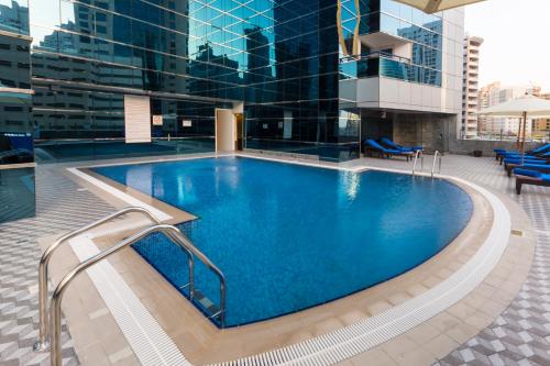 The swimming pool at or close to Golden Tulip Media Hotel