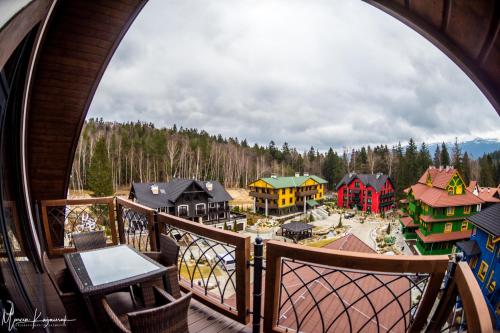 a view of a town from a balcony at Norweska Dolina Family&Pet-friendly Resort in Szklarska Poręba