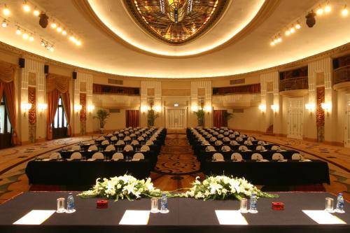 a large room with rows of tables in a hall at Okura Garden Hotel Shanghai in Shanghai