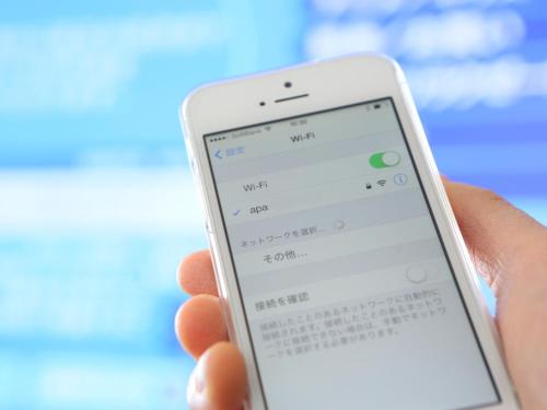a person holding a cell phone in their hand at APA Hotel Higashi Umeda Minami Morimachi Ekimae in Osaka