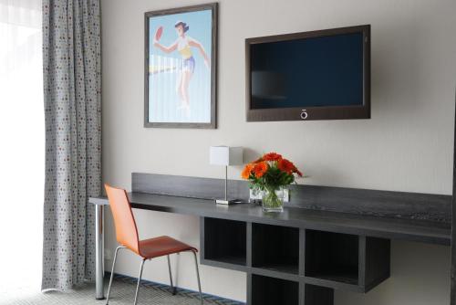 TV a/nebo společenská místnost v ubytování Trans World Hotel Auefeld