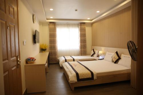 Katil atau katil-katil dalam bilik di Huynh Duc 2 Hotel