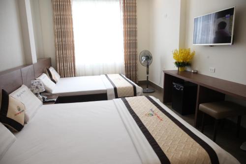 Katil atau katil-katil dalam bilik di Huynh Duc 2 Hotel